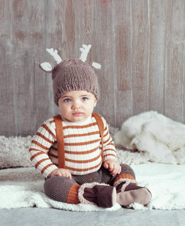 Jorden wears Blueberry Hill hat, striped top and suspender pants by Tun Tun and Robeez boots.