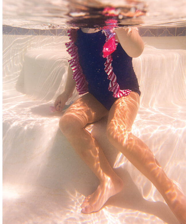Georgia wears Planet Sea ruffle one-piece.