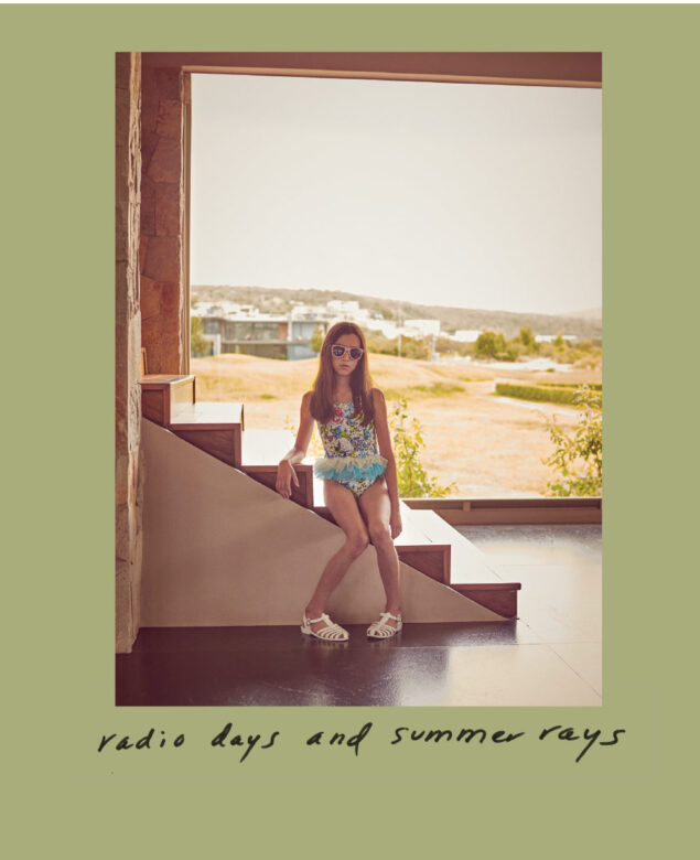 Carlotta is wearing swimwear from Lola and the Boys, sunglasses from Wee Farers and vintage sandals.