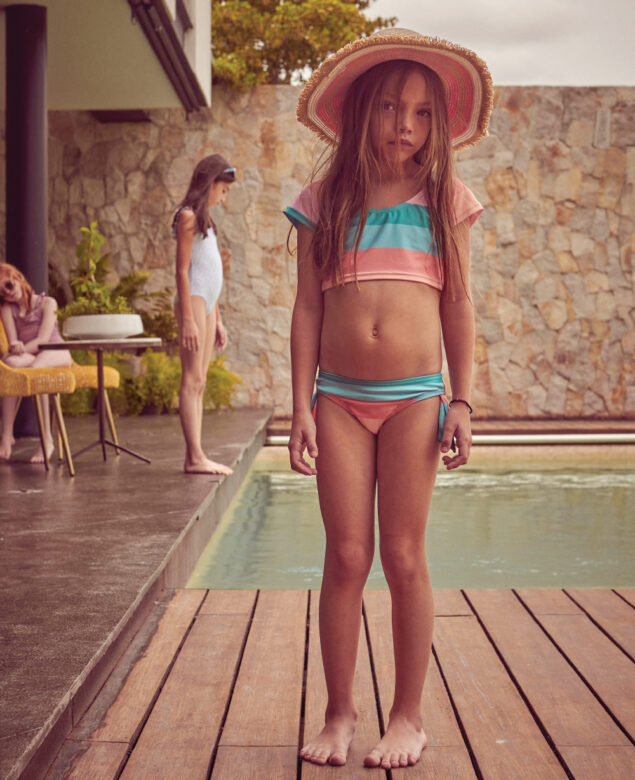 From left: Léo is wearing swimwear by Verrone and sunglasses by Jonas Paul Eyewear; Carlotta is wearing 
swimwear by Minnow and sunglasses from Wee Farers; Andy is wearing swimwear and hat by Snapper Rock.