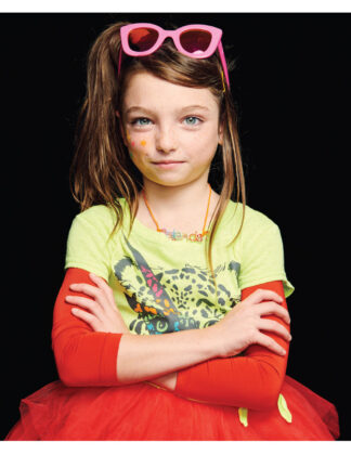 Kylie wears top by Appaman, Iloveplum long-sleeved tutu dress, necklace by Charm It 
and sunglasses by Sons + Daughters.