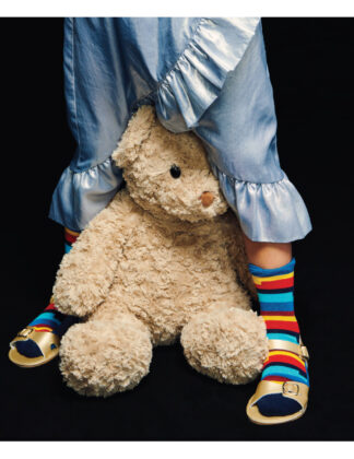 Samara wears jacket by Western Chief, shirt by 
Anchors n Asteroids, collar by Cosmosophie, blue skirt 
by Kenzo, Baby Deer shoes, Fun Socks striped socks and Steiff teddy bear.