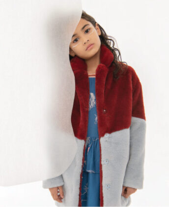 Myami wears Molo coat and unicorn dress.