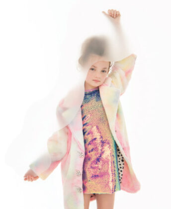 Sophia wears Bonnie Jean dress worn under Widgeon beige faux fur hooded jacket.