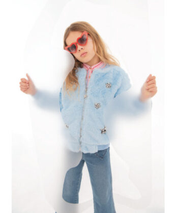 Sophia wears Lola + the Boys blue faux fur bomber and red sunglasses with Hatley striped button-
down and jeans.
