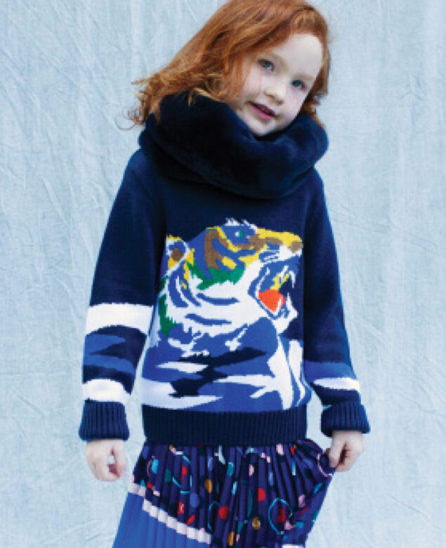 Ariana wears Kenzo sweater, Catimini pleated skirt, and Tartine Au Chocolat neck warmer.