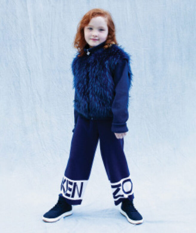 Ariana wears Kenzo pants with Appaman faux fur zip-up.