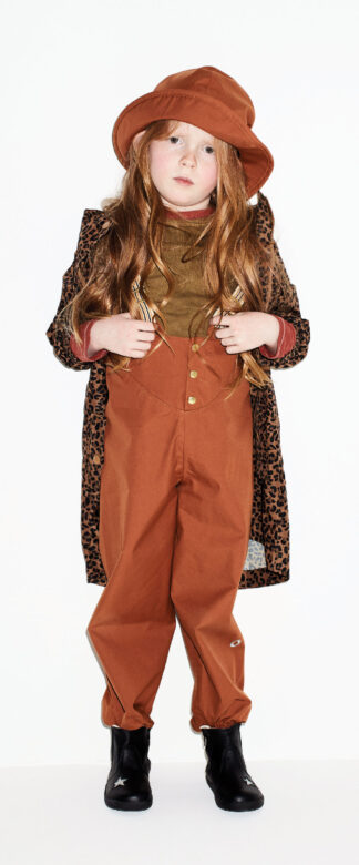 Hannah wears Faire Child overalls and hat, Joules leopard raincoat, 
Kidential red and green T-shirts and Old Soles boots.