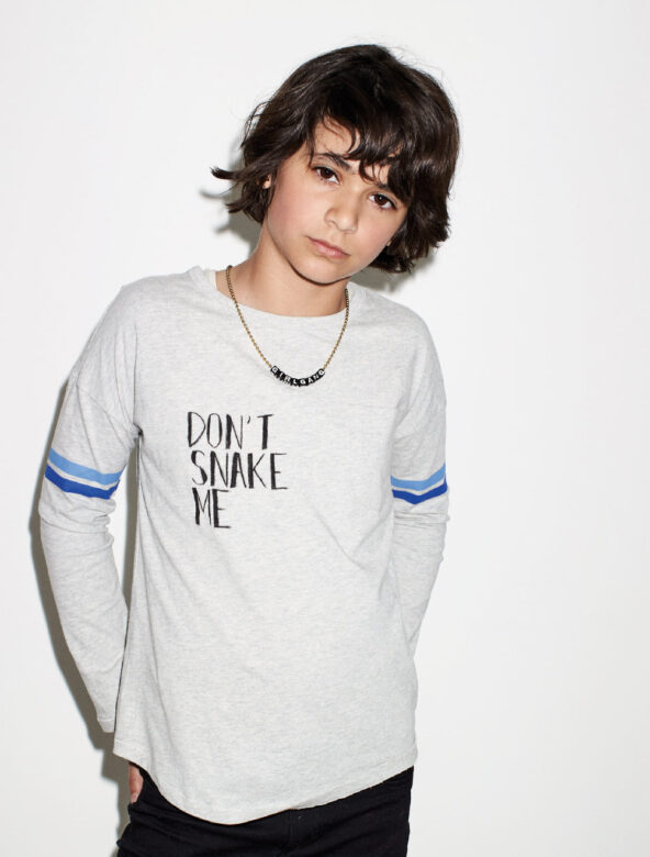 Lola wears Tea Collection shirt 
(customized with her own message) with necklace 
by Gunner & Lux