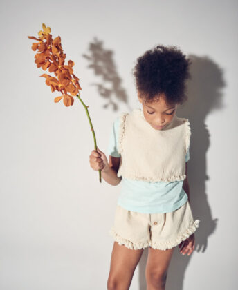 Laniya wears matching fringe top and shorts 
by Yellowpelota and blue tee by Kidential.
