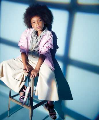 Laniya wears windbreaker by Puma, top by Cosmosophie, Unlabel wide-leg pants, Geox sandals and holds Toucca Kids sunglasses.
