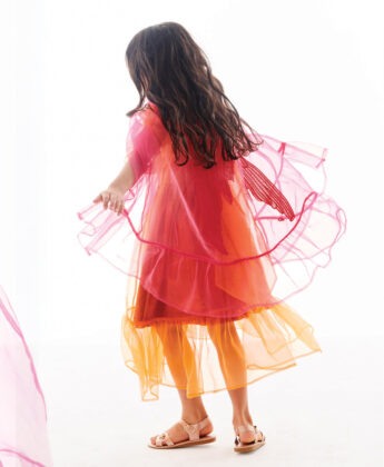 Samsara wears sheer dress 
and cape by Carbon Soldier over dress by Pink Chicken.