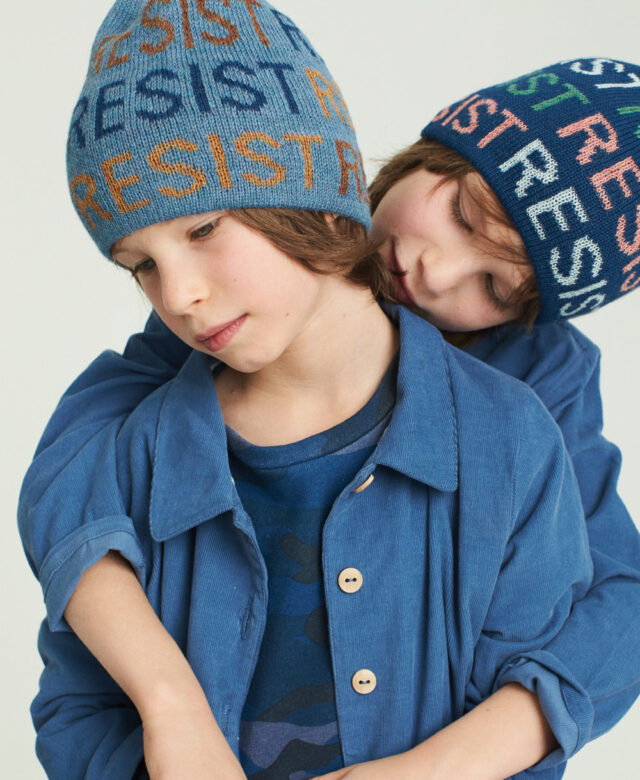 Asher wears Oeuf hat and jacket with Appaman camo shirt; Sawyer wears Oeuf hat and overalls.